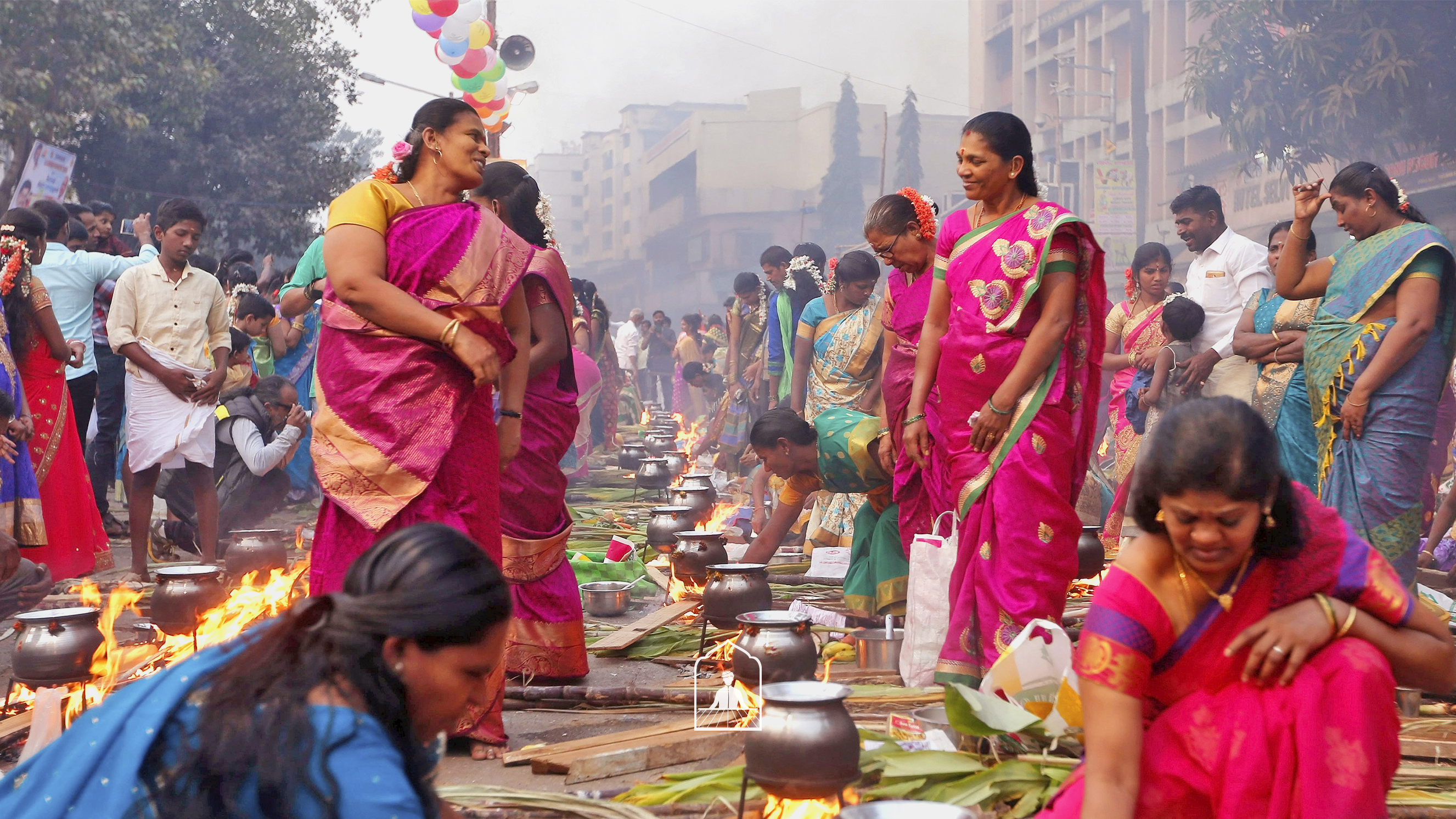 tamilian women making pongal dish while wearing traditional kanjeevaram sarees - for pongal 2024